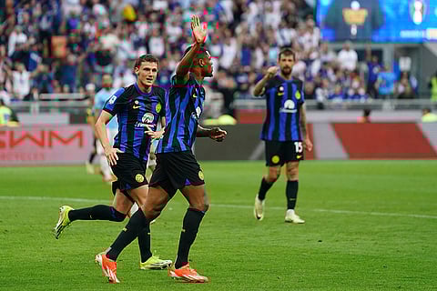 Denzel Dumfries celebrates scoring a goal